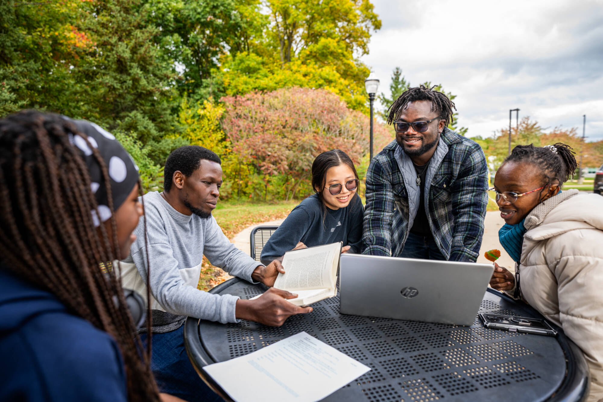 International students study and talk outside Lake Ontario Hall, where the Padnos International Center is located, October 11, 2023. (photo by Amanda Pitts)